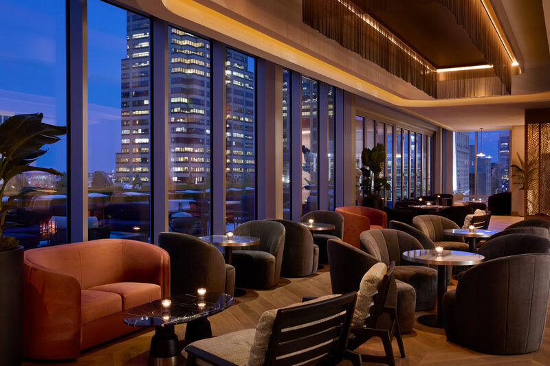 astrea lounge seating with city skyline views